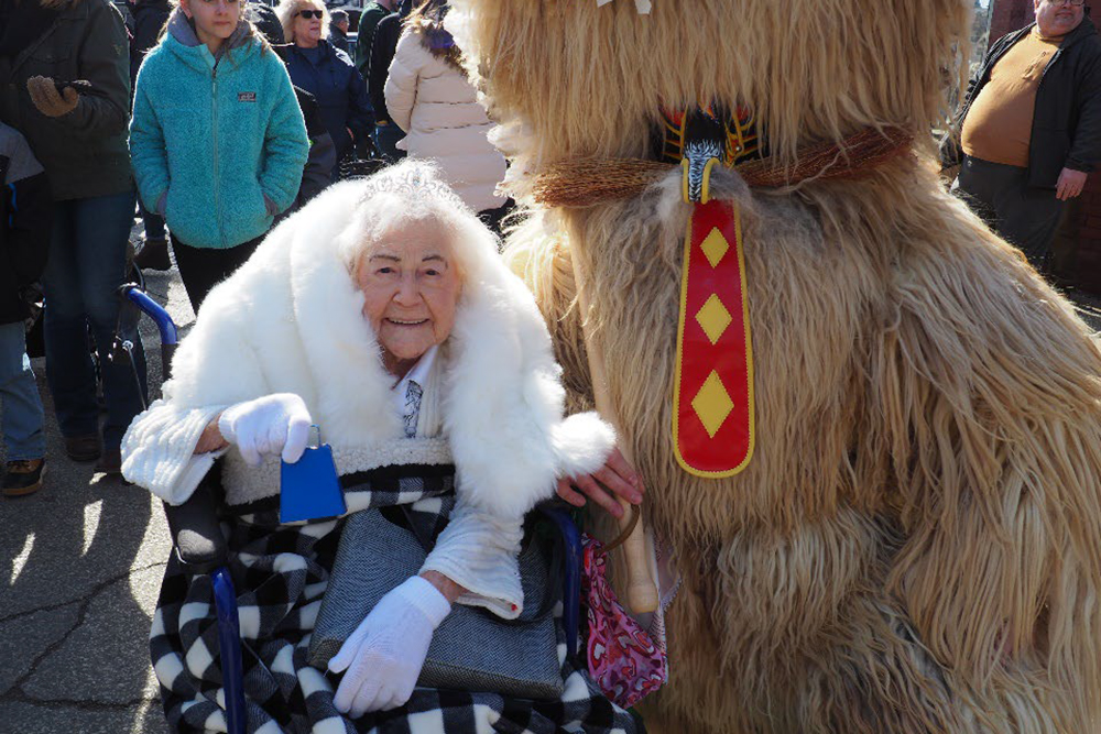 2023 Cleveland Kurentovanje Queen, Eva Ozbolt Kisley with a Kurent after the annual parade